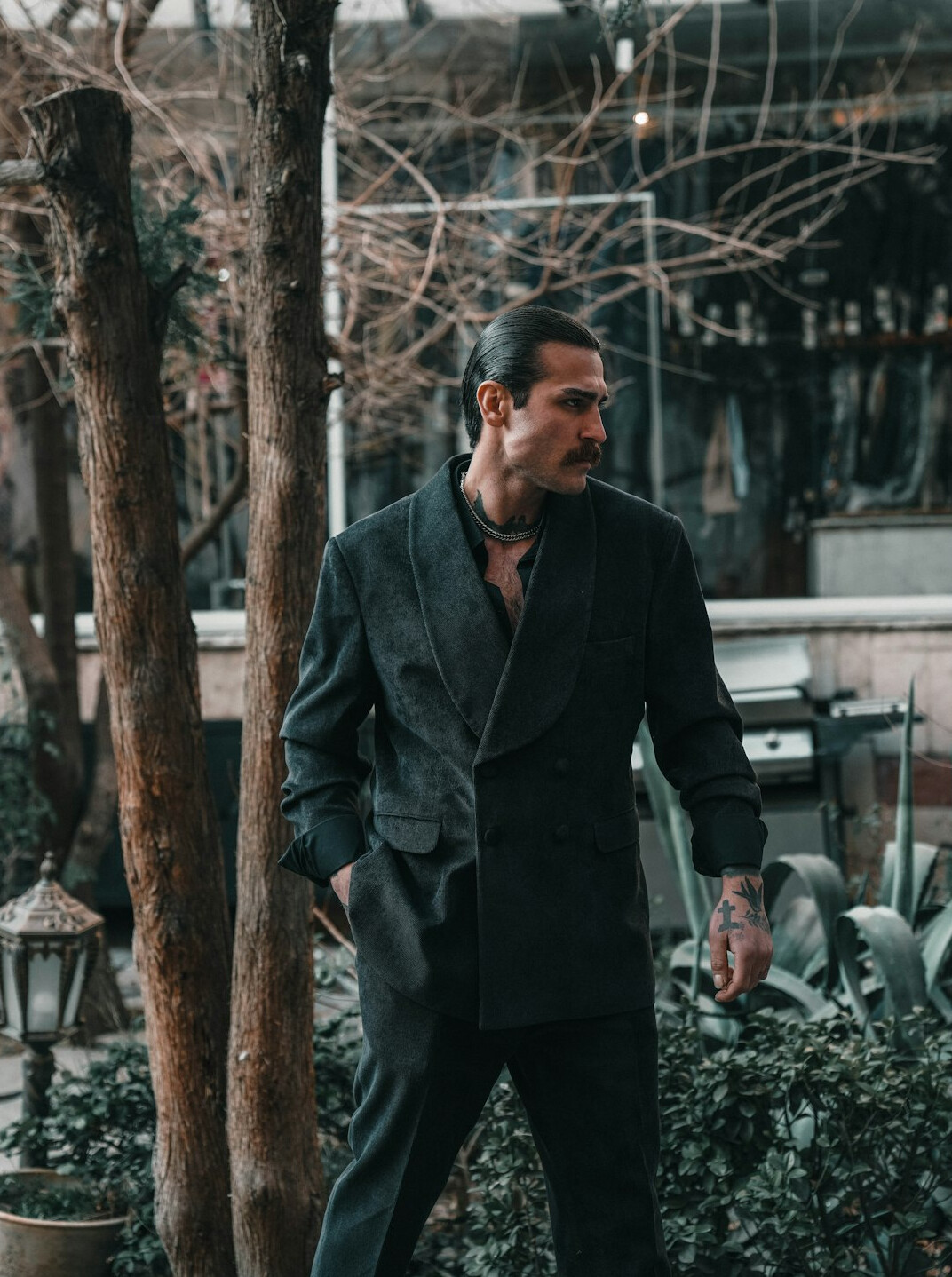 Portrait of a Turkish man in his 40s wearing a blazer