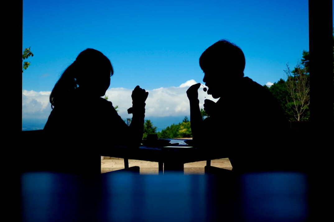 Two people having a calm mediated conversation at a table